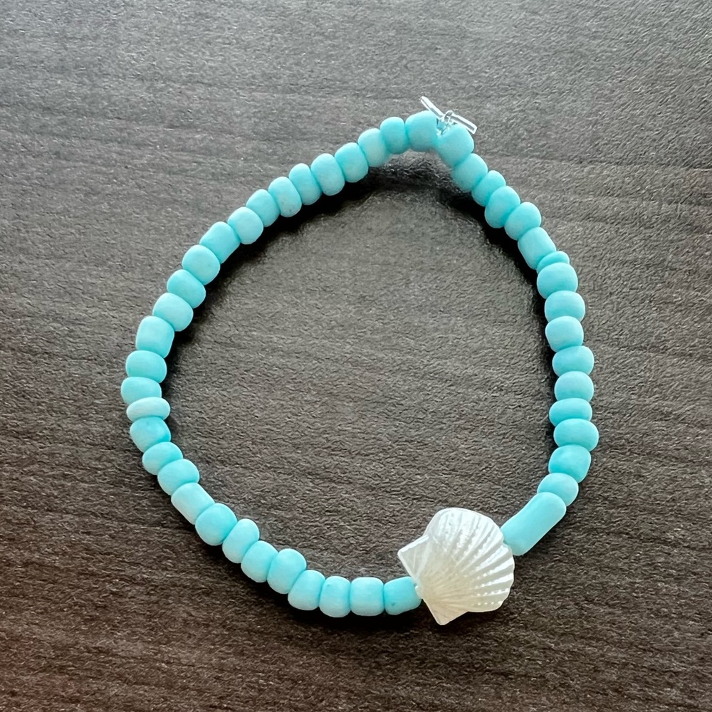 Light blue glass seed beads with shell accent
